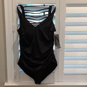 Magicsuit by Miraclesuit ladder back ruched black one piece bathing suit.